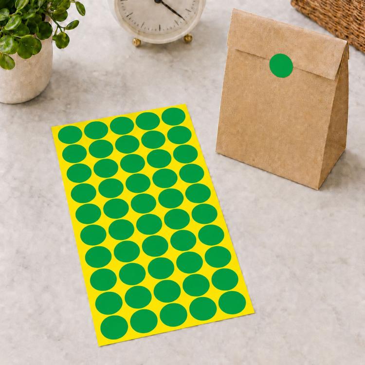 Round self-adhesive sticker labels sheet with green circular dots