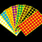 Round self-adhesive dot sticker sheets in mixed colors, stacked together