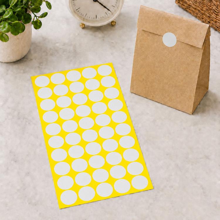 White round self-adhesive sticker labels sheet with white dot circles on yellow backing