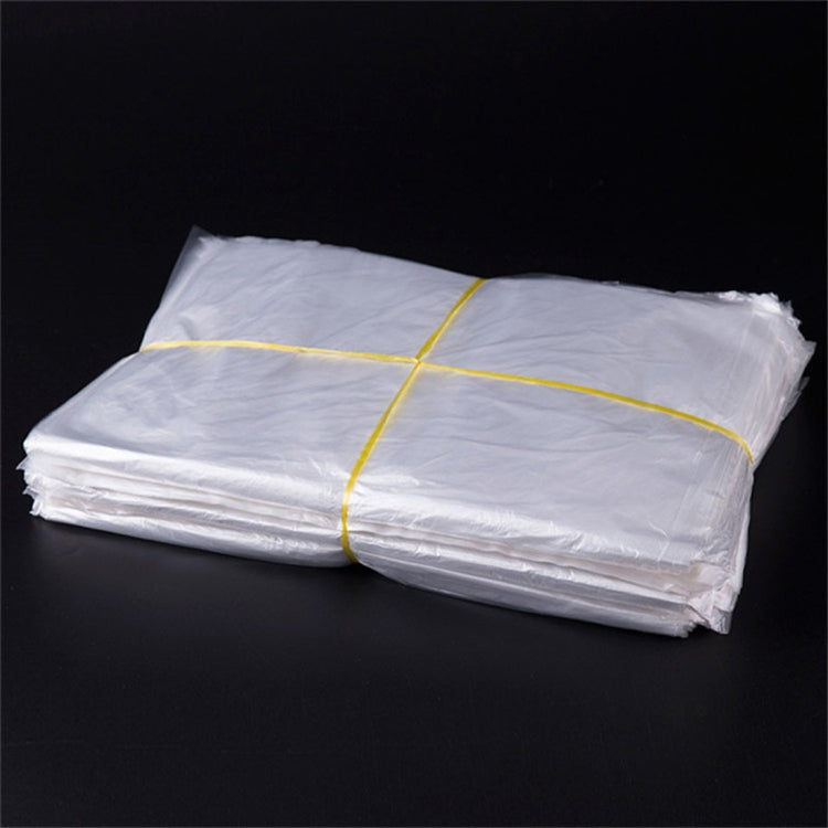 Pack of folded white PE plastic bags, 60cm x 80cm, yellow band tied