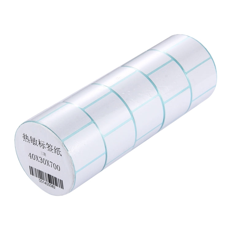 Thermal barcode label roll end view with barcode strip and light blue label grid