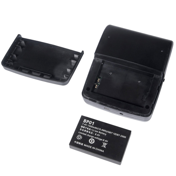 Black portable printer with open casing, internal parts, and removable battery