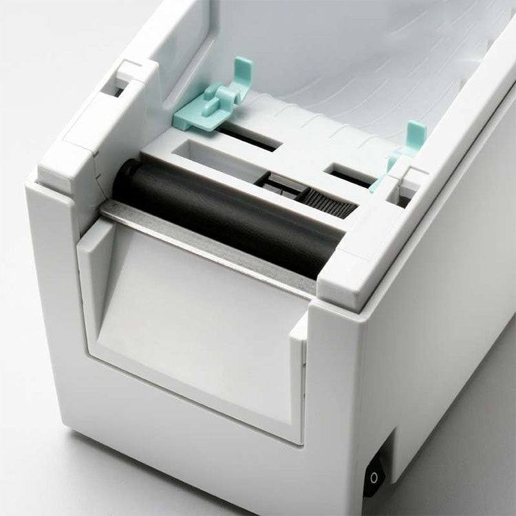 Open thermal label printer showing the internal print roller and label path, white housing