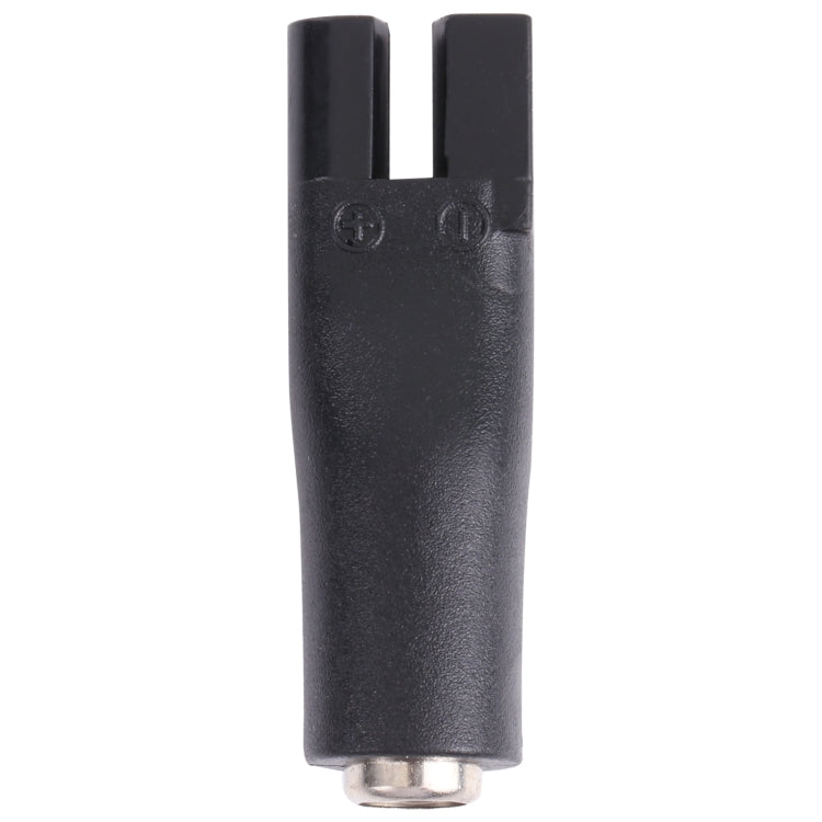 Black DC shaver interface adapter plug with forked slot and round metal connector