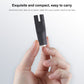 Black DC shaver interface converter held in hand, compact plug adapter