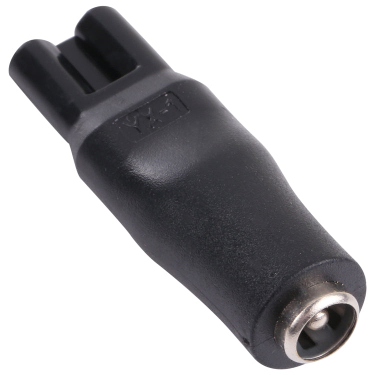 Black DC adapter plug with metal ring on the connector tip for shaver interface