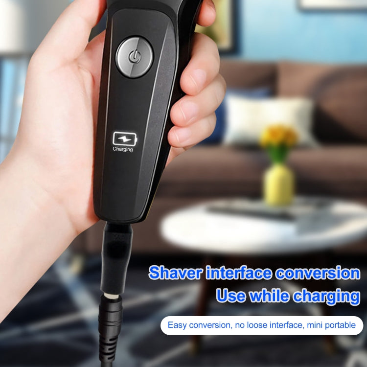 Black handheld DC adapter with power button, charging indicator, and connected cable