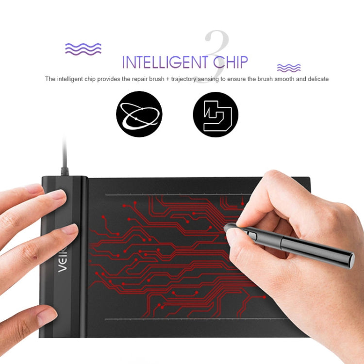 Hands using stylus on dark electronic graphic tablet with circuit pattern