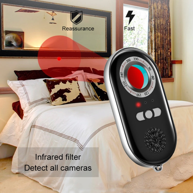Vibration alarm key fob on a bed with red indicator light