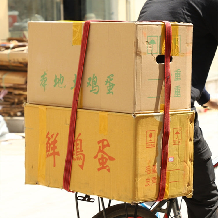 Elastic packing strap with hook on stacked cardboard boxes, red strap