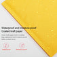 Orange kraft paper bubble mailer envelope with water droplets on coated outer surface