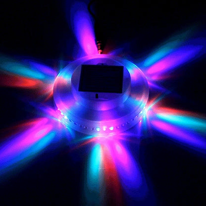LED sunflower stage light projecting multi-color beams with a dark center housing