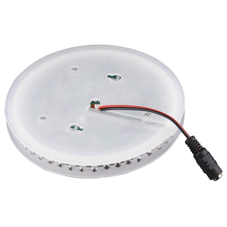 White circular LED stage light with clear cover, ring LEDs, and connected power cable