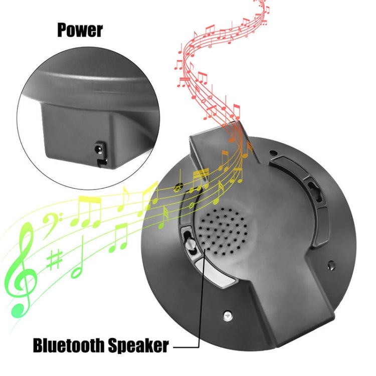 Black projector base with built-in speaker grille and power port; blue LED light