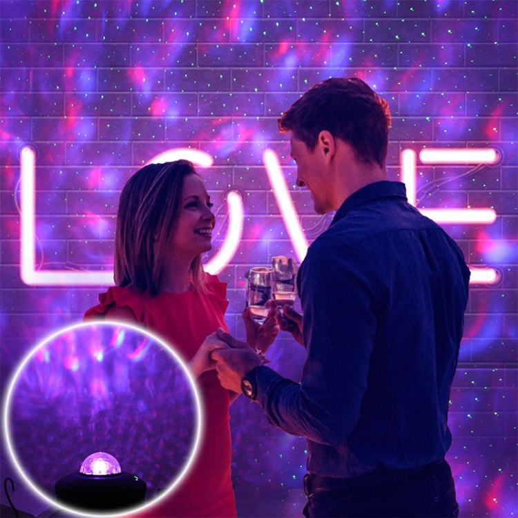 Small blue dome projector light with remote, creating glowing laser patterns