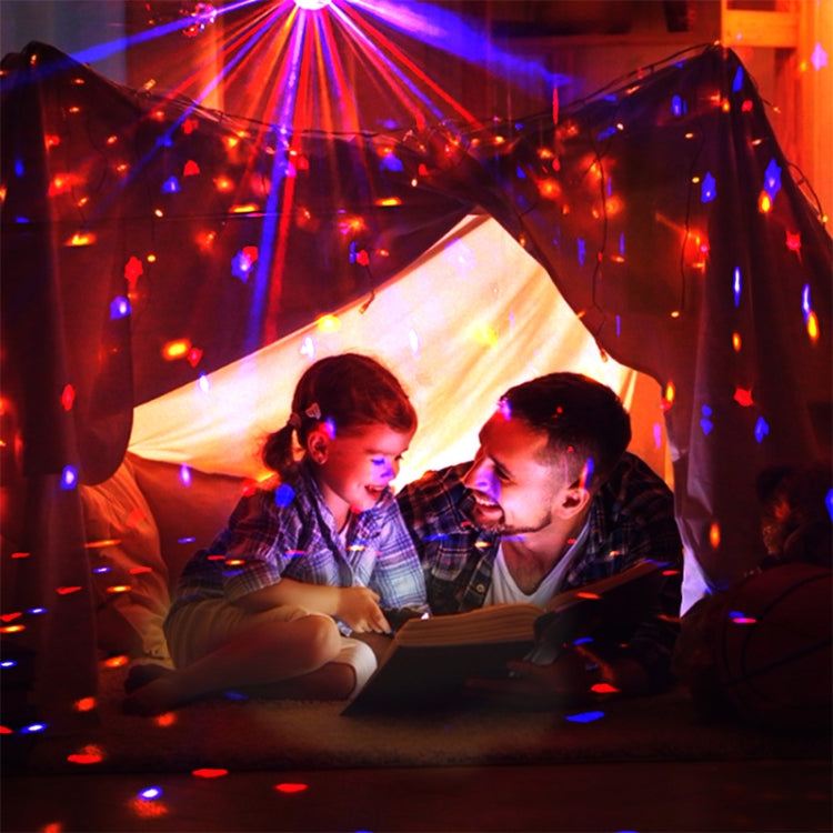 Warm and cool disco light projections from a crystal magic ball stage light