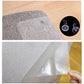 Clear adhesive PVC sheet on textured sofa fabric, hand peeling protective backing