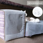 Clear PVC scratch guard panel on sofa armrest, cat playing beside it