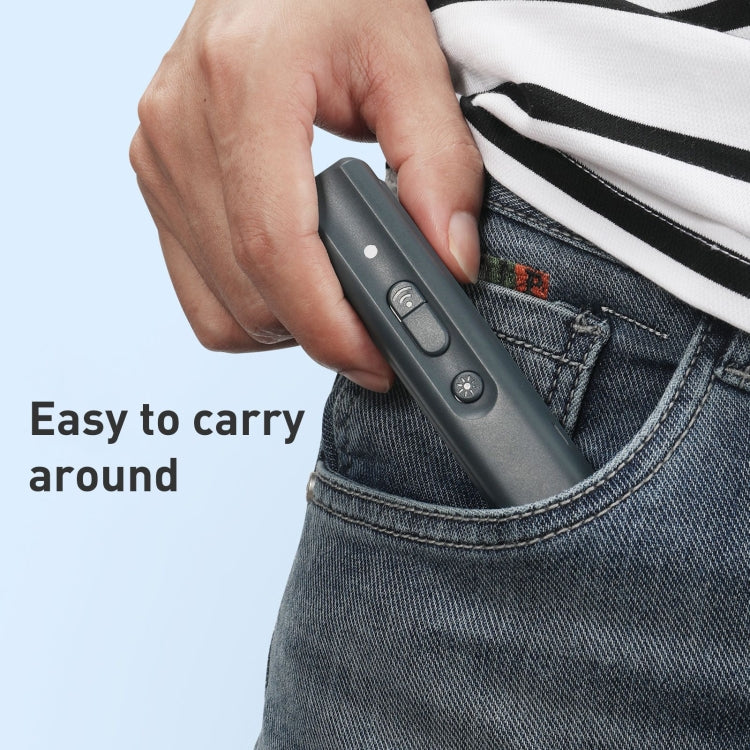 Black N11 ultrasonic dog repeller tucked in jeans pocket, with button controls visible