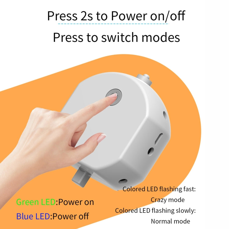Auto pet toy ball base with a hand pressing the switch for power and modes