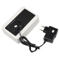 White wooden digital clock with power adapter plug and connected cable