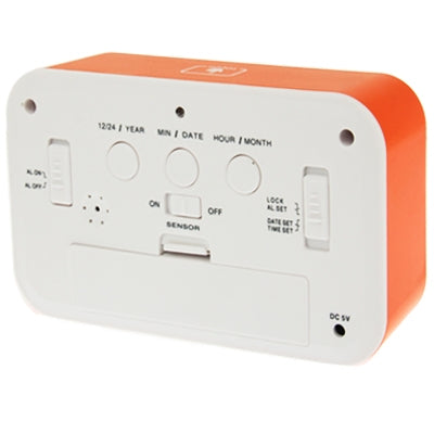 Orange and white multi-function alarm clock back panel with buttons and DC port