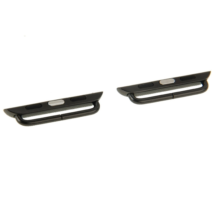 Two black metal watch strap connectors showing underside bar and pin slots