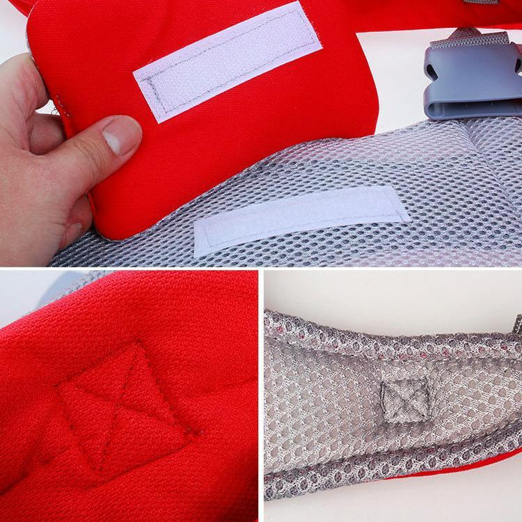 Red baby carrier backpack close-up of padded panels and adjustable gray webbing
