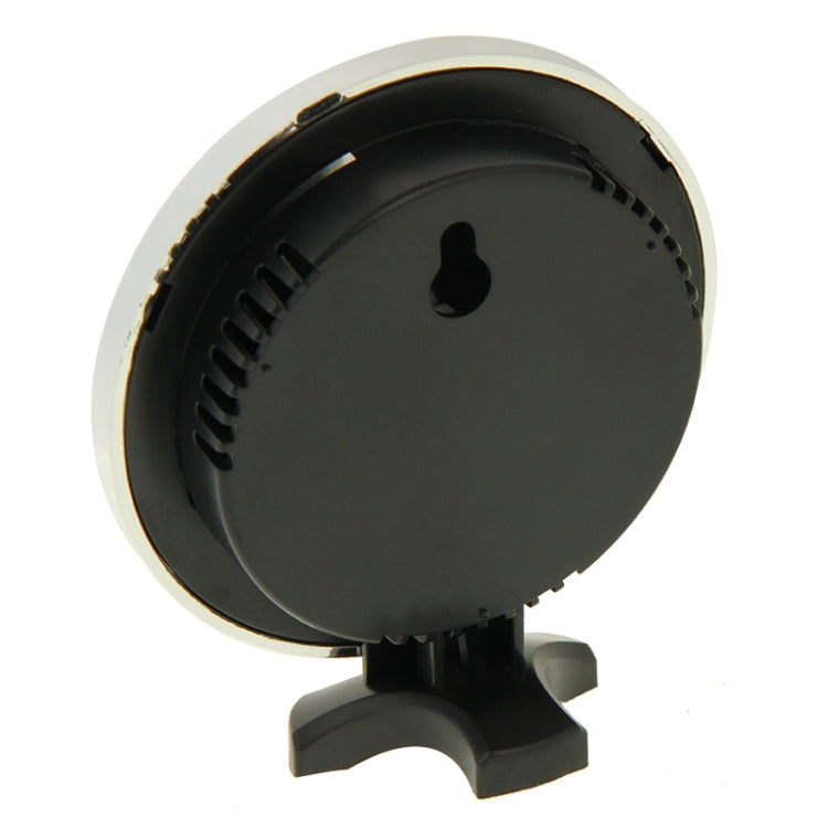 Round thermometer and hygrometer underside view with black casing and vent slots