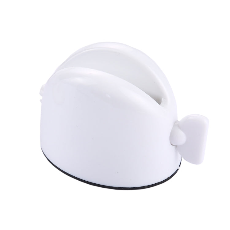White desktop toothpaste squeezer with side lever; curved dome top and black base edge