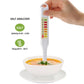Hand holding salinity analyzer meter inserted into cup of soup for salt testing