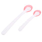 Two temperature sensor spoons with long white handles and pink oval bowls