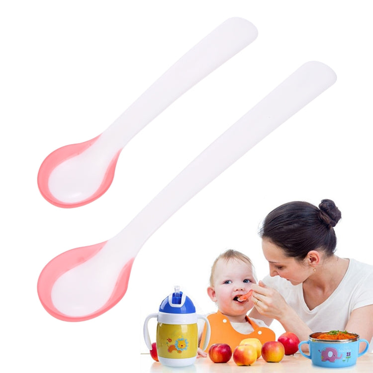 Two temperature sensor spoons, white handles with pink oval sensor bowls