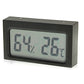 Black mini digital thermometer humidity monitor with LCD screen displaying % and °F