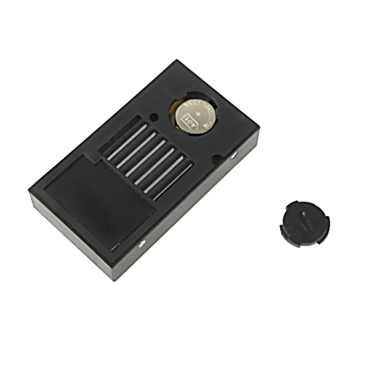 Black mini digital thermometer humidity monitor back view with battery compartment
