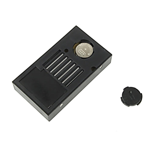 Black mini digital thermometer humidity monitor back view with battery compartment