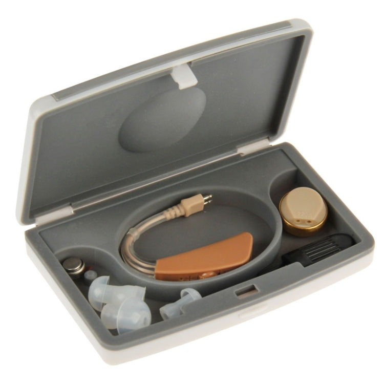 Open hearing aid case with beige device, clear tubing, white ear tips, and accessory tool
