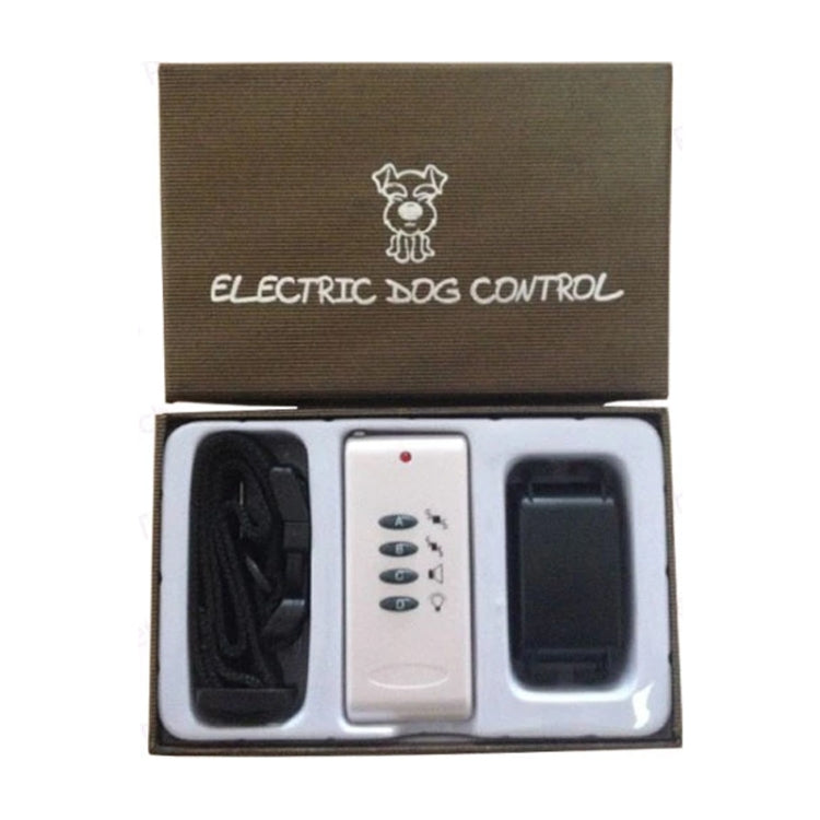 Open box electric dog control kit with white remote and black strap and receiver