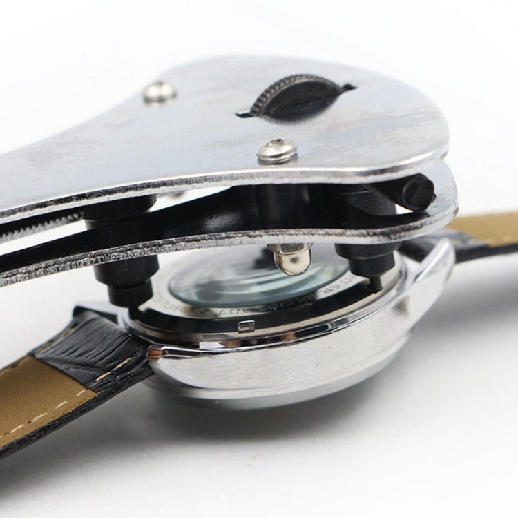 Watch case opener pressing on watch case back with circular base and screws