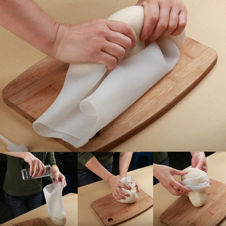 White silicone kneading dough bag used with hands on a wooden board