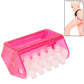Pink handheld roller massager with white nodule wheel and arched handle