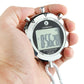 Close-up digital stopwatch with LCD screen, silver bezel, and white braided wrist strap