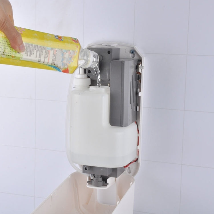 Installed touchless liquid soap dispenser with internal tank compartment exposed