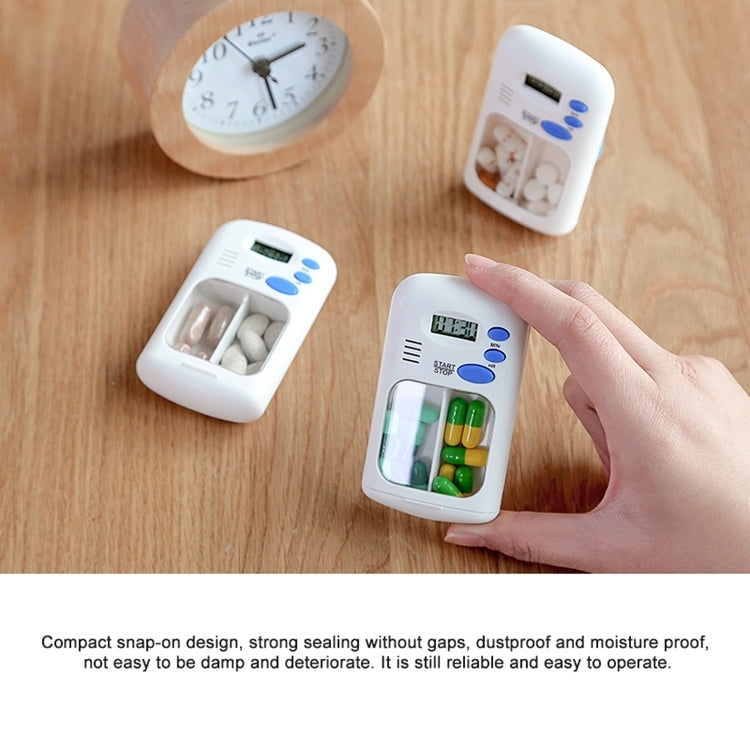 Smart pill reminder timer box on wooden table with two units and LCD screens