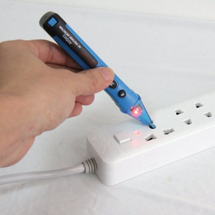 Hand using blue non-contact AC voltage detector on power strip with LED glow
