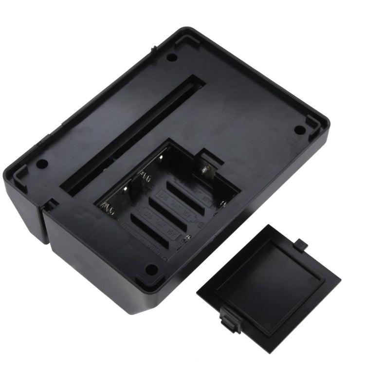 Mini paper shredder bottom open showing battery compartment and internal contacts