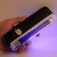 Handheld UV security blacklight with clear cover and circular power controls