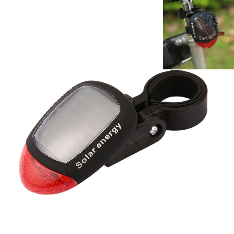 Solar bicycle tail light with solar panel window and red rear reflector lens