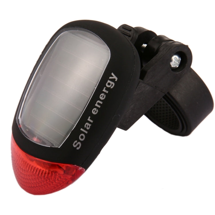 Solar bicycle tail light with red lens and solar panel on black mounting bracket