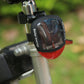 Solar bicycle tail light mounted on a bicycle seat post with red lens